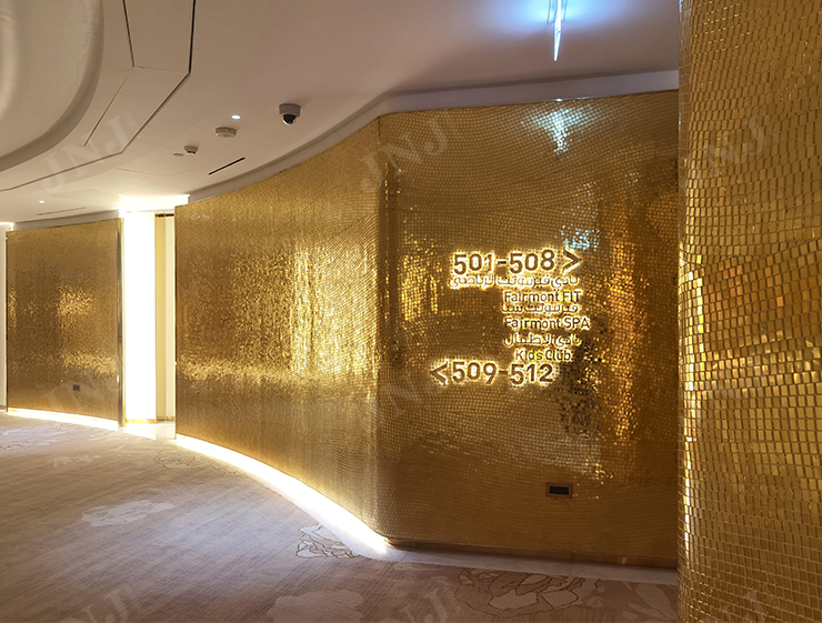 Over 5000 square meters of 24K gold mosaic tiles extending from floor to ceiling in Fairmont Doha lobby