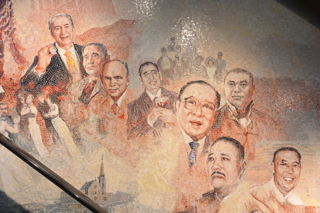 Close-up detail of the mosaic mural, showing the exquisite craftsmanship of tiling realistic portraits and replicating rich oil painting textures.