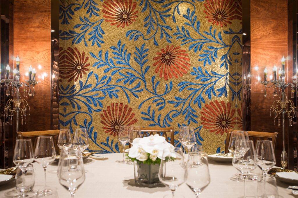 Fine dining restaurant ambiance with handcrafted floral mosaic mural by JNJMosaic