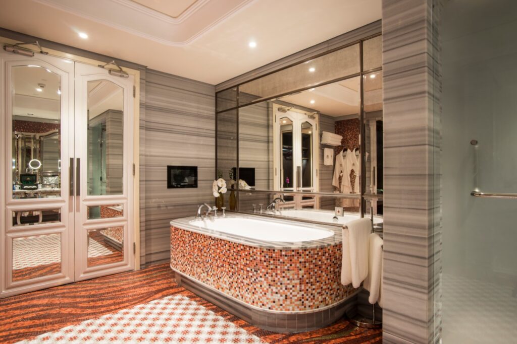 Luxury hotel suite bathroom artistic mosaic accent wall by JNJMosaic