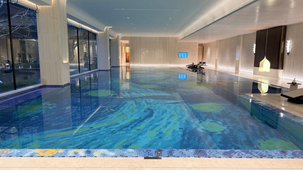 How to Choose Pool Mosaic Tiles: A Project-Based Guide 15 Van Gogh Starry Night mosaic artwork across the indoor pool floor