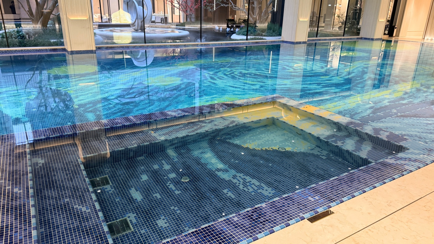 lue mosaic spa pool with custom geometric color transitions