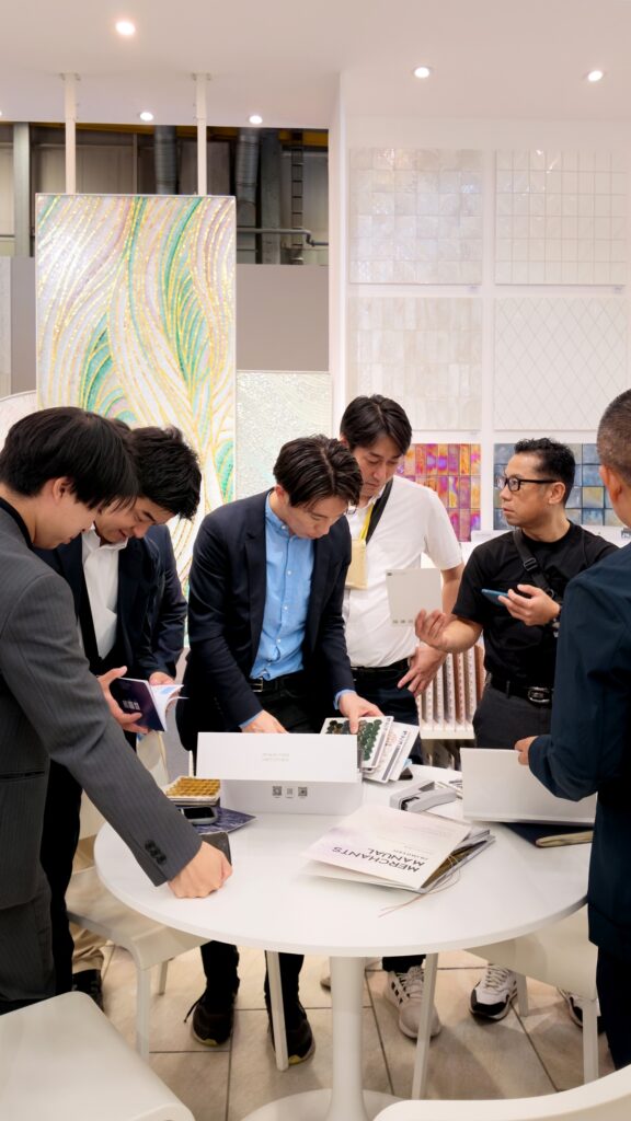 Inside the JNJMosaic Booth at Cersaie 2026: Art, Materials and Meaningful Conversations 9 JNJ Mosaic team discussing materials and project possibilities with visitors