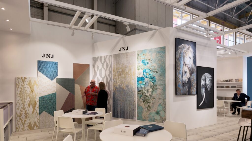 Inside the JNJMosaic Booth at Cersaie 2026: Art, Materials and Meaningful Conversations 2 Artistic mosaic mural and decorative panels displayed at the JNJ booth