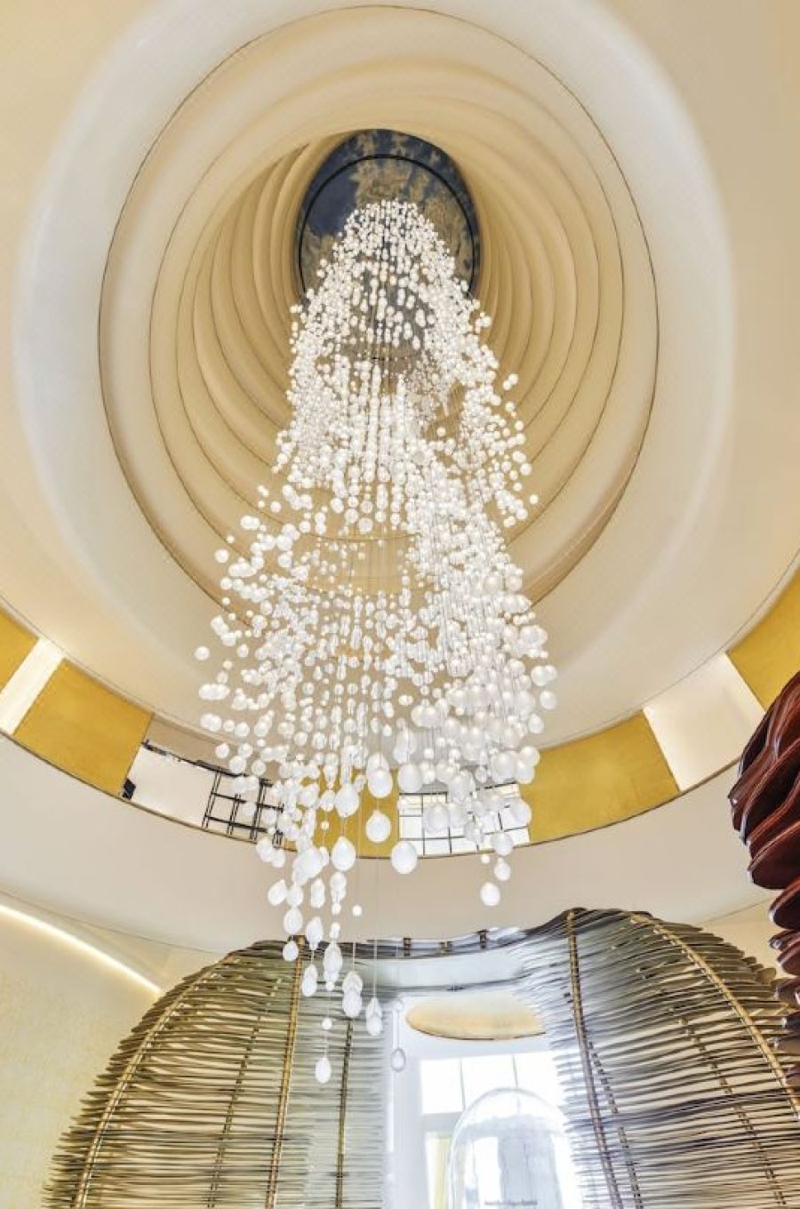 Grand lobby atrium of Fairmont Doha featuring the world's tallest chandelier and luxury interior design