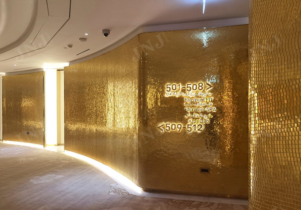 Over 5000 square meters of 24K gold mosaic tiles extending from floor to ceiling in Fairmont Doha lobby