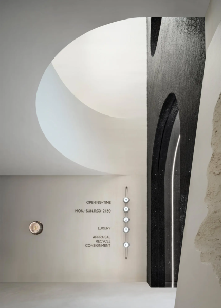 White mosaic wall surfaces creating a gallery-inspired retail environment