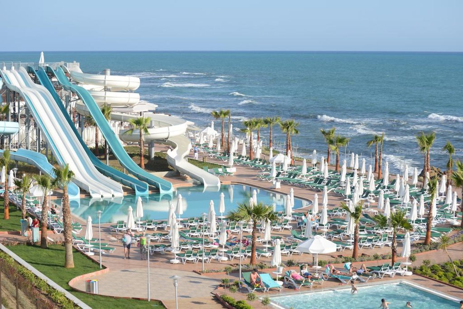Outdoor swimming pool and Mediterranean beachfront at Vikingen Infinity Resort & Spa
