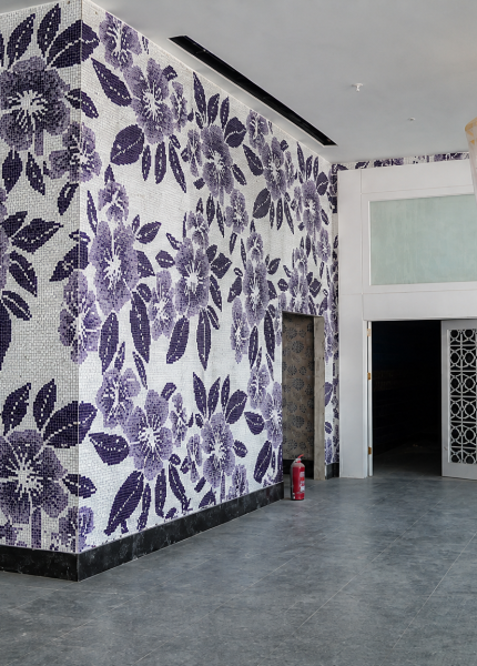 Rose mosaic wall at the elevator lobby and corridor transition space