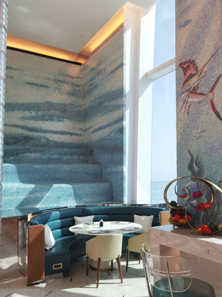 Custom JNJ Mosaic wall pattern featuring surging ocean waves in the Fairmont Doha restaurant