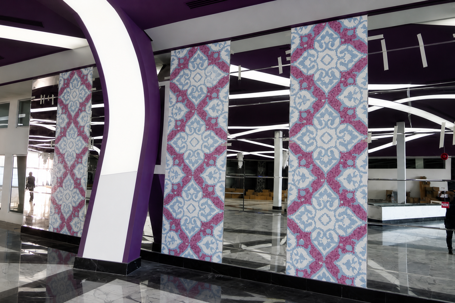 Chinese knot mosaic wall with mirrored accents in the hotel corridor