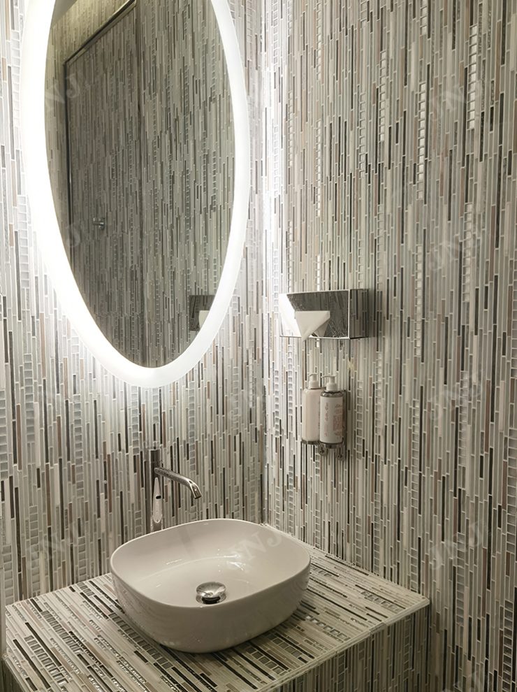 Custom JNJ geometric striped mosaic tiles paired with artistic floral patterns for a transitional wall