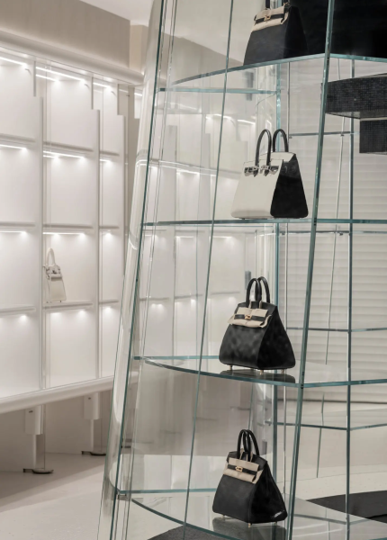Luxury accessories display within a mosaic-designed retail environment