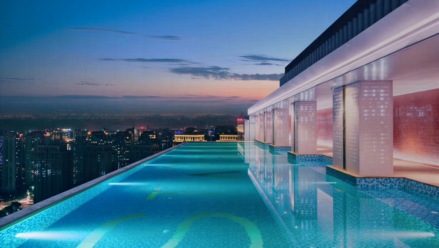 Starry City rooftop infinity pool with custom glass mosaic tiles by JNJMosaic