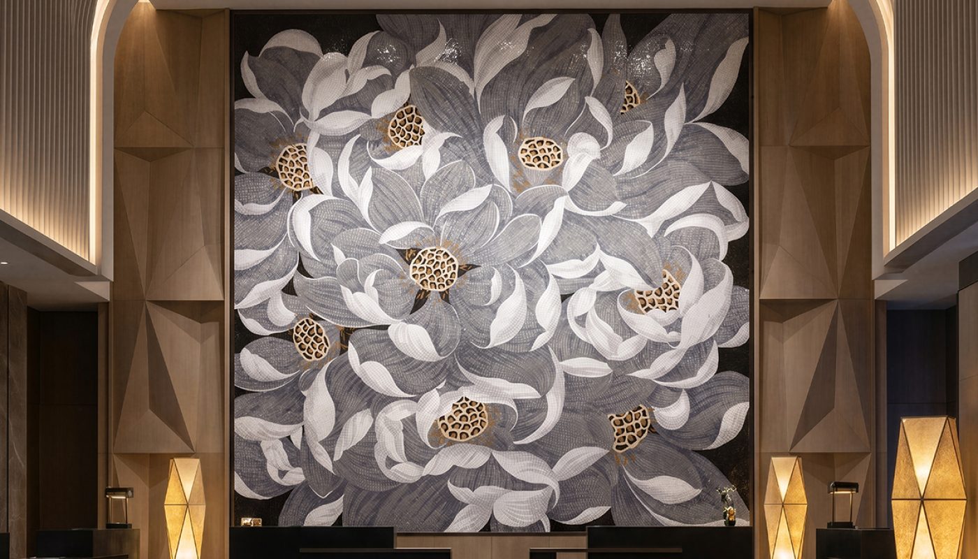 custom artistic mosaic feature wall in luxury hotel lobby
